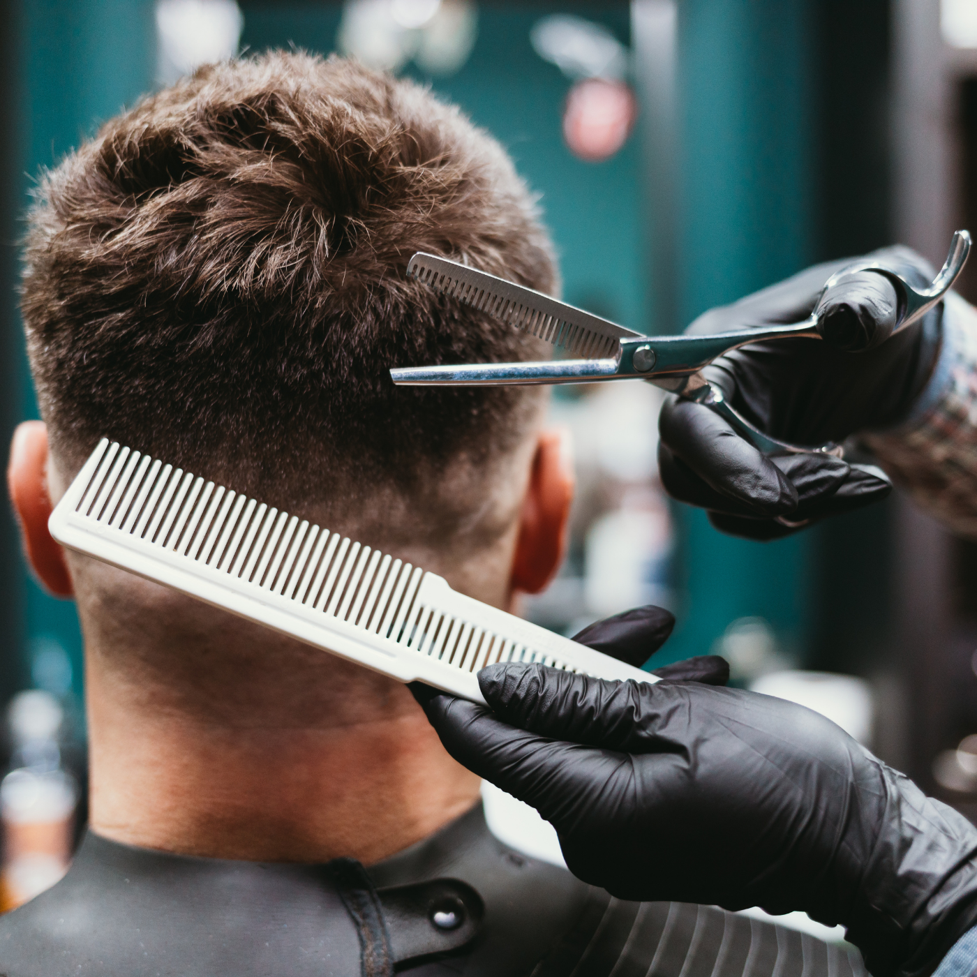 Barber cutting a client’s hair